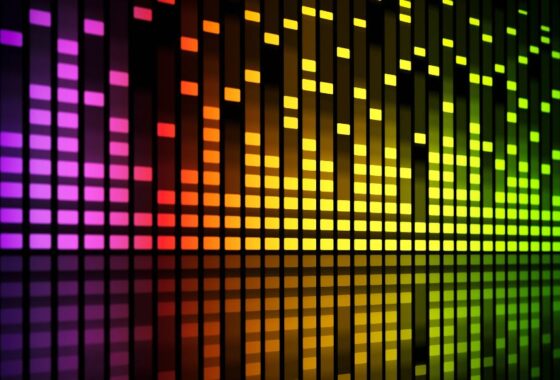 A colourful background in the style of a hi-fi sound level readout, with gradiating pink orange and yellow squares.