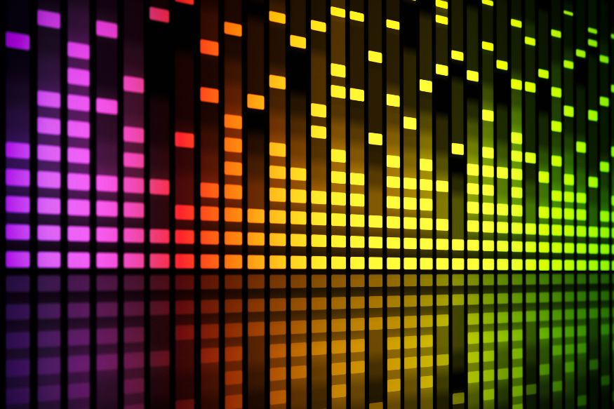 A colourful background in the style of a hi-fi sound level readout, with gradiating pink orange and yellow squares.