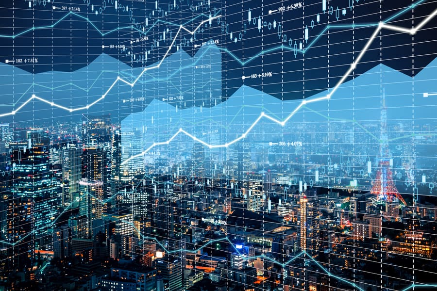A stock market graph with a city in the background.