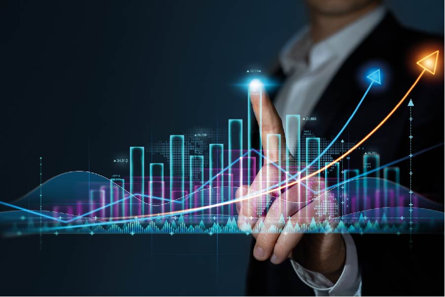An abstract photograph of a professional pointing to a floating glowing bar graph